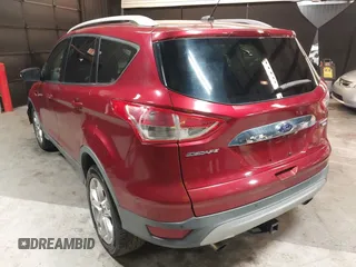 2014 Ford Escape Titanium with VIN 1FMCU9J9XEUD69589, listed as a IAAI auction lot 42031882 with 123,632 mi miles and . Bid and sale history available at DreamBid. Image 3.