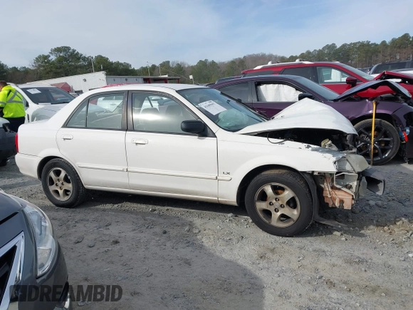 2000 Mazda Protege DX with VIN JM1BJ2221Y0208156, listed as a IAAI auction lot 41609657 with 435,304 mi miles and . Bid and sale history available at DreamBid. Image 12.