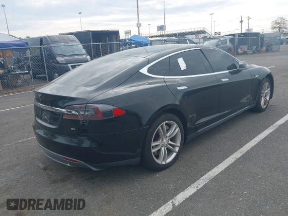 2014 Tesla Model S 60 with VIN 5YJSA1H13EFP33693, listed as a IAAI auction lot 42132094 with Not Provided miles and . Bid and sale history available at DreamBid. Image 4.