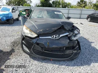2013 Hyundai Veloster w/Gray Int z VIN KMHTC6AD1DU101406, wystawiony jako Copart lot #55087095 z przebiegiem 115 373 mil mil oraz Szkoda całkowita • Salvage title. Historia ofert i sprzedaży dostępna na DreamBid. Obrazek 5.