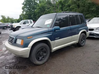1997 Suzuki Sidekick z VIN JS3TD21V7V4109189, wystawiony jako IAAI lot #42526480 z przebiegiem 133 248 mil mil oraz . Historia ofert i sprzedaży dostępna na DreamBid. Obrazek 2.