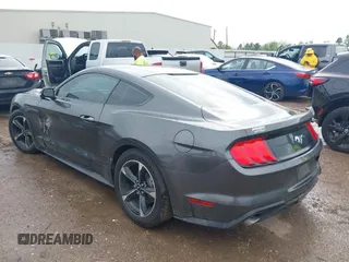 2018 Ford Mustang EcoBoost z VIN 1FA6P8TH2J5184485, wystawiony jako IAAI lot #41884810 z przebiegiem 74 999 mil mil oraz . Historia ofert i sprzedaży dostępna na DreamBid. Obrazek 3.