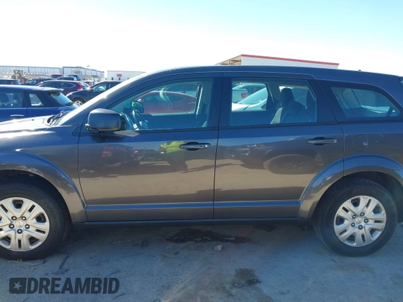 2015 Dodge Journey SE z VIN 3C4PDCAB5FT739266, wystawiony jako IAAI lot #41725086 z przebiegiem 134 109 mil mil oraz . Historia ofert i sprzedaży dostępna na DreamBid. Obrazek 14.