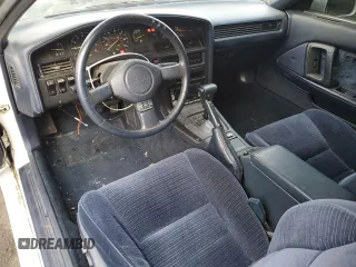 1987 Toyota Supra z VIN JT2MA70L2H0044216, wystawiony jako Copart lot #78864694 z przebiegiem 143 418 mil mil oraz Czysty tytuł • Clean title. Historia ofert i sprzedaży dostępna na DreamBid. Obrazek 8.