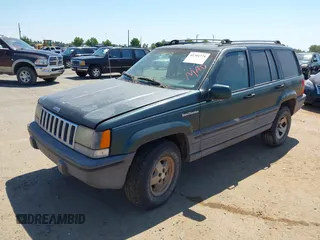 1994 Jeep Grand Cherokee Laredo with VIN 1J4GZ58S2RC118502, listed as a IAAI auction lot 42701778 with 420,559 mi miles and . Bid and sale history available at DreamBid. Image 2.