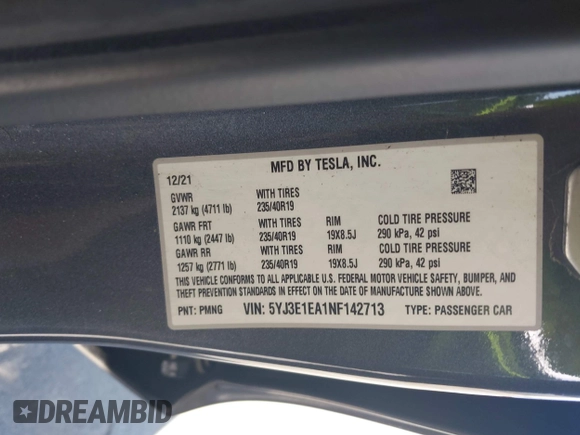 2022 Tesla Model 3 with VIN 5YJ3E1EA1NF142713, listed as a IAAI auction lot 42027630 with 112,557 mi miles. Bid and sale history available at carsss.com. Image 9.