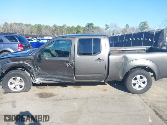 2009 Nissan Frontier LE with VIN 1N6AD09U79C402623, listed as a IAAI auction lot 41656385 with 286,777 mi miles and . Bid and sale history available at DreamBid. Image 14.