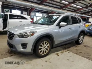 2016 Mazda CX-5 Grand Touring z VIN JM3KE4DY9G0627332, wystawiony jako Copart lot #61476385 z przebiegiem 311 023 mil mil oraz Czysty tytuł • Clean title. Historia ofert i sprzedaży dostępna na DreamBid. Obrazek 1.
