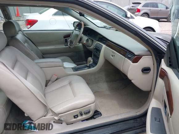 2002 Cadillac Eldorado ESC z VIN 1G6EL12Y82B105241, wystawiony jako IAAI lot #42241609 z przebiegiem 90 442 mil mil oraz . Historia ofert i sprzedaży dostępna na DreamBid. Obrazek 5.