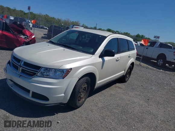 2014 Dodge Journey SE with VIN 3C4PDCAB9ET121415, listed as a IAAI auction lot 42138601 with 157,043 mi miles. Bid and sale history available at carsss.com. Image 2.
