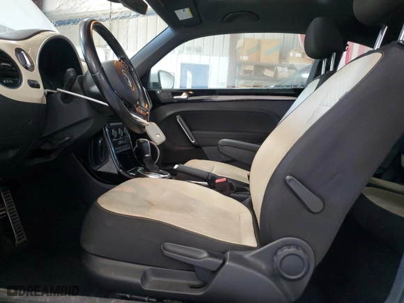 2019 Volkswagen Beetle S with VIN 3VWFD7AT4KM703324, listed as a Copart auction lot 77000024 with 93,346 mi miles and Salvage Title. Bid and sale history available at carsss.com. Image 7.