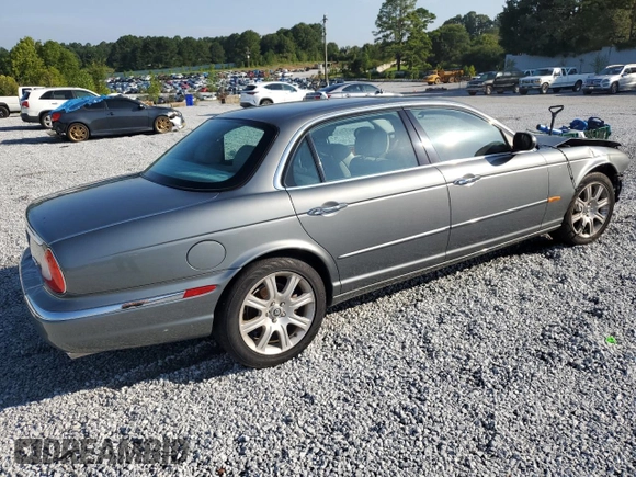 2005 Jaguar XJ with VIN SAJWA79C65SG45989, listed as a Copart auction lot 65357044 with 103,587 mi miles and Salvage Title. Bid and sale history available at carsss.com. Image 3.