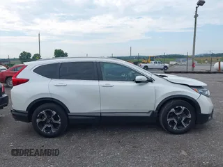 2018 Honda CR-V Touring with VIN 2HKRW2H91JH665241, listed as a IAAI auction lot 42638694 with 62,066 mi miles and . Bid and sale history available at DreamBid. Image 13.