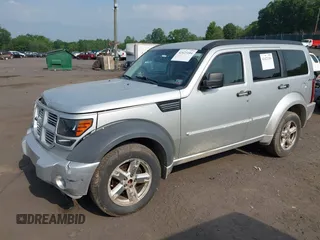2010 Dodge Nitro SXT z VIN 1D4PU5GK8AW146087, wystawiony jako IAAI lot #42423104 z przebiegiem 220 381 mil mil oraz . Historia ofert i sprzedaży dostępna na DreamBid. Obrazek 2.