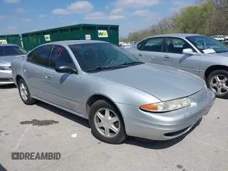 2003 Oldsmobile Alero GL1 z VIN 1G3NL52EX3C229081, wystawiony jako IAAI lot #42023246 z przebiegiem 188 796 mil mil oraz . Historia ofert i sprzedaży dostępna na DreamBid. Obrazek 1.