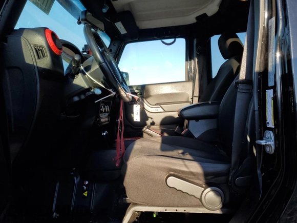 2018 Jeep Wrangler JK Unlimited Sport S with VIN 1C4BJWDG2JL874348, listed as a Copart auction lot 77430104 with 115,813 mi miles and Salvage Title. Bid and sale history available at carsss.com. Image 7.