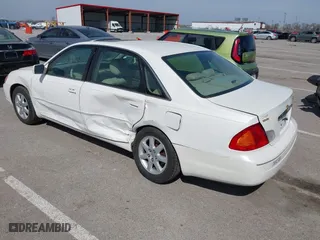 2001 Toyota Avalon XL w/Bucket Seats with VIN 4T1BF28B61U169213, listed as a IAAI auction lot 41829245 with 99,940 mi miles. Bid and sale history available at carsss.com. Image 3.