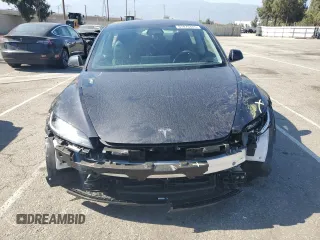 2025 Tesla Model 3 Long Range with VIN 5YJ3E1EA8SF896333, listed as a Copart auction lot 61876445 with 5,690 mi miles and Salvage title. Bid and sale history available at DreamBid. Image 5.