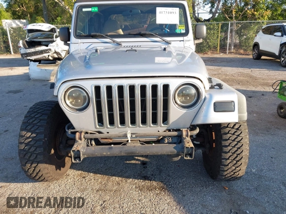 2005 Jeep Wrangler Unlimited with VIN 1J4FA44S65P335444, listed as a IAAI auction lot 41731093 with 143,918 mi miles. Bid and sale history available at carsss.com. Image 6.