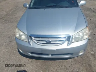 2004 Kia Spectra LX with VIN KNAFE122145037581, listed as a IAAI auction lot 41965681 with 49,817 mi miles. Bid and sale history available at carsss.com. Image 6.