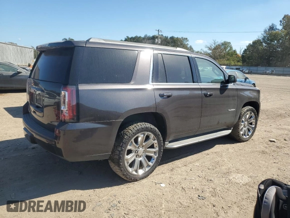 2015 GMC Yukon SLT with VIN 1GKS1BKC0FR239629, listed as a Copart auction lot 77414814 with 171,611 mi miles and Salvage Title. Bid and sale history available at carsss.com. Image 3.