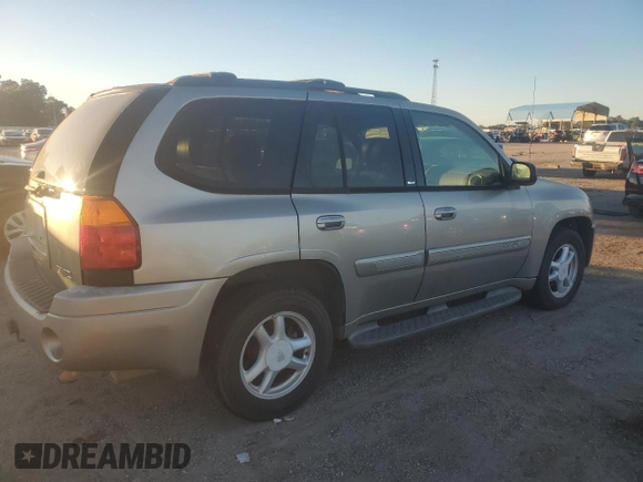 2003 GMC Envoy SLE with VIN 1GKDS13S932170188, listed as a Copart auction lot 82027964 with 266,978 mi miles and Clean Title. Bid and sale history available at carsss.com. Image 3.
