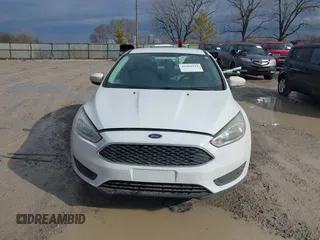 2016 Ford Focus SE z VIN 1FADP3F23GL343651, wystawiony jako IAAI lot #41668112 z przebiegiem 120 891 mil mil oraz . Historia ofert i sprzedaży dostępna na DreamBid. Obrazek 13.