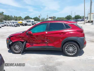 2021 Hyundai Kona SEL with VIN KM8K22AA8MU601480, listed as a IAAI auction lot 39589701 with 55,876 mi miles and . Bid and sale history available at carsss.com. Image 14.