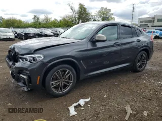 2021 BMW X4 M40i with VIN 5UX2V5C0XM9F04867, listed as a Copart auction lot 57890555 with 40,563 mi miles and Salvage title. Bid and sale history available at DreamBid. Image 1.