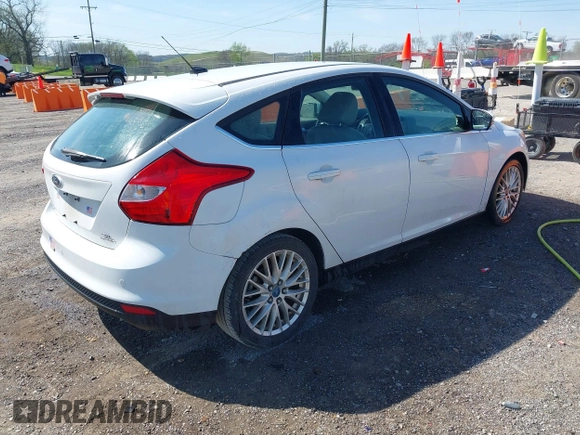 2012 Ford Focus SEL with VIN 1FAHP3M21CL413436, listed as a IAAI auction lot 42011706 with 392,754 mi miles. Bid and sale history available at carsss.com. Image 4.