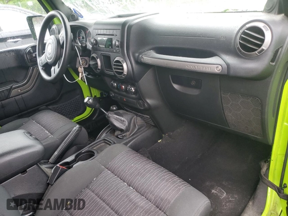 2012 Jeep Wrangler Sport with VIN 1C4AJWAG2CL233722, listed as a Copart auction lot 61125095 with 49,864 mi miles and Salvage title. Bid and sale history available at DreamBid. Image 8.