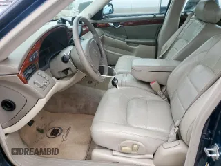 2005 Cadillac DeVille z VIN 1G6KD54Y75U129768, wystawiony jako Copart lot #55890325 z przebiegiem 97 463 mil mil oraz Czysty tytuł • Clean title. Historia ofert i sprzedaży dostępna na DreamBid. Obrazek 7.
