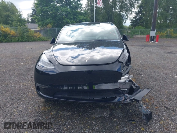2023 Tesla Model Y Long Range z VIN 7SAYGDEE2PF885116, wystawiony jako IAAI lot #40091902 z przebiegiem 11 779 mil mil oraz . Historia ofert i sprzedaży dostępna na DreamBid. Obrazek 12.