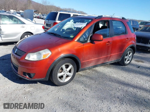 2009 Suzuki SX4 Touring AWD z VIN JS2YB417595100925, wystawiony jako IAAI lot #41693882 z przebiegiem 76 972 mil mil oraz . Historia ofert i sprzedaży dostępna na DreamBid. Obrazek 2.