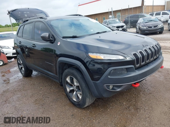 2015 Jeep Cherokee Trailhawk with VIN 1C4PJMBS5FW647601, listed as a IAAI auction lot 42437734 with 170,640 mi miles and . Bid and sale history available at DreamBid. Image 1.