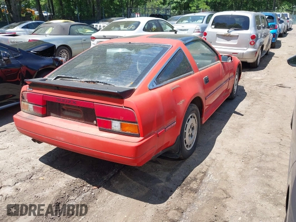 1986 Nissan 300ZX z VIN JN1HZ14S4GX164916, wystawiony jako IAAI lot #42295717 z przebiegiem 254 114 mil mil oraz . Historia ofert i sprzedaży dostępna na DreamBid. Obrazek 4.