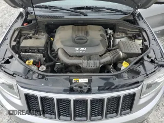 2014 Jeep Grand Cherokee Laredo with VIN 1C4RJEAG2EC179547, listed as a Copart auction lot 53328055 with 107,451 mi miles and Salvage Title. Bid and sale history available at DreamBid. Image 12.