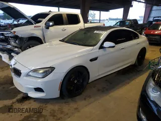 2015 BMW M6 z VIN WBS6C9C59FD467571, wystawiony jako Copart lot #85105724 z przebiegiem 128 295 mil mil oraz Tytuł czysty. Historia ofert i sprzedaży dostępna na DreamBid. Obrazek 1.