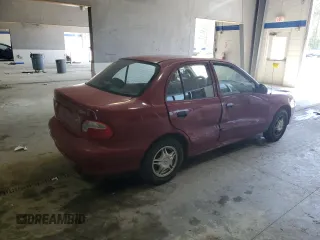 1999 Hyundai Accent z VIN KMHVF24N5XU575750, wystawiony jako Copart lot #52190805 z przebiegiem 205 655 mil mil oraz Tytuł czysty. Historia ofert i sprzedaży dostępna na DreamBid. Obrazek 3.