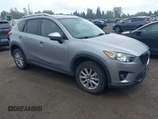 2014 Mazda CX-5 Touring z VIN JM3KE4CY1E0415832, wystawiony jako IAAI lot #42294233 z przebiegiem 77 727 mil mil oraz . Historia ofert i sprzedaży dostępna na DreamBid. Obrazek 1.