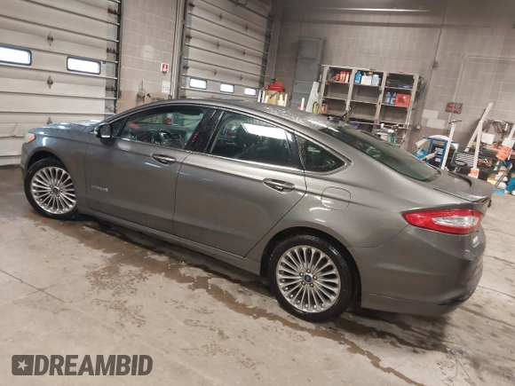 2013 Ford Fusion Titanium Hybrid with VIN 3FA6P0RU6DR319586, listed as a IAAI auction lot 42138979 with 125,388 mi miles. Bid and sale history available at carsss.com. Image 3.