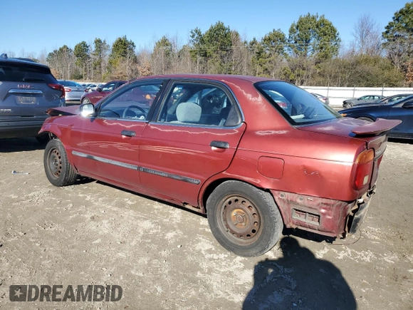 2001 Suzuki Esteem GL z VIN JS2GB41S915202412, wystawiony jako Copart lot #88372235 z przebiegiem 301 061 mil mil oraz Szkoda całkowita • Salvage title. Historia ofert i sprzedaży dostępna na DreamBid. Obrazek 2.