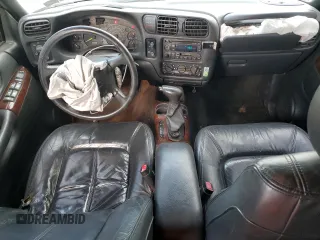 1999 Oldsmobile Bravada z VIN 1GHDT13W6X2718787, wystawiony jako Copart lot #78848404 z przebiegiem 229 665 mil mil oraz Szkody całkowita. Historia ofert i sprzedaży dostępna na DreamBid. Obrazek 8.