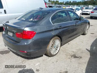 2013 BMW 3 Series 328i xDrive with VIN WBA3B3G56DNR81144, listed as a IAAI auction lot 40620694 with 159,022 mi miles. Bid and sale history available at carsss.com. Image 4.