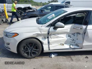 2020 Ford Fusion SE with VIN 3FA6P0HD3LR161093, listed as a IAAI auction lot 42127161 with 59,607 mi miles and . Bid and sale history available at DreamBid. Image 6.