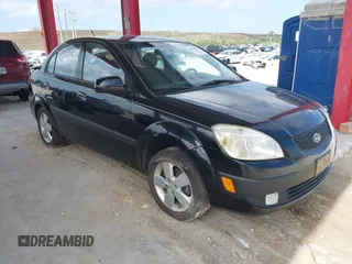 2009 Kia Rio LX with VIN KNADE223496561265, listed as a IAAI auction lot 42143889 with 235,634 mi miles and . Bid and sale history available at DreamBid. Image 1.
