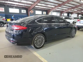 2017 Ford Fusion Titanium z VIN 3FA6P0K96HR124759, wystawiony jako Copart lot #61414395 z przebiegiem 175 655 mil mil oraz Czysty tytuł • Clean title. Historia ofert i sprzedaży dostępna na DreamBid. Obrazek 3.