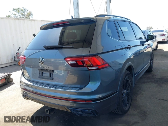 2022 Volkswagen Tiguan SE R-Line Black with VIN 3VVCB7AX8NM039730, listed as a IAAI auction lot 42313651 with 71,759 mi miles and . Bid and sale history available at DreamBid. Image 4.
