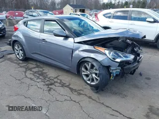 2016 Hyundai Veloster z VIN KMHTC6AD9GU275017, wystawiony jako IAAI lot #41885522 z przebiegiem 113 300 mil mil oraz . Historia ofert i sprzedaży dostępna na DreamBid. Obrazek 1.