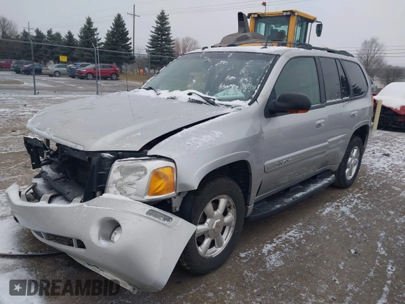 2005 GMC Envoy SLT with VIN 1GKDT13S352258640, listed as a IAAI auction lot 41226997 with 159,665 mi miles. Bid and sale history available at carsss.com. Image 17.